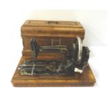 VINTAGE GERMAN METAL SEWING MACHINE contained in a walnut and inlaid case