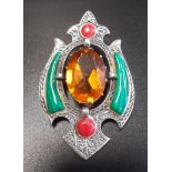 SILVER AND STONE SET BROOCH the central oval cut Cairngorm with malachite and carnelian set surround