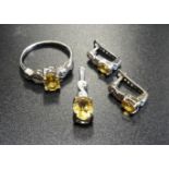 SUITE OF CITRINE AND DIAMOND JEWELLERY comprising a ring, a pair of earrings and a pendant, all in