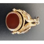 AGATE SET SWIVEL FOB in nine carat gold mount decorated with a pair of doves, approximately 8.5