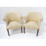 PAIR OF MODERN TUB ARMCHAIRS covered in an ivory ground material with terracotta and green fleur