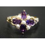 AMETHYST AND SEED PEARL DRESS RING the four oval cut amethysts separated by seed pearls, on nine