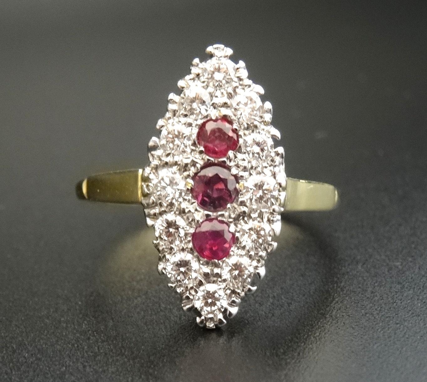 ART DECO STYLE DIAMOND AND RUBY CLUSTER RING the three central vertically set rubies in navette