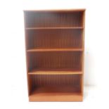 TEAK OPEN BOOKCASE with a moulded top above four shelves, standing on a plinth base, 132cm x 81cm