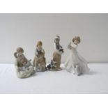 FOUR LLADRO FIGURINES of young girls playing with cats, 24.5cm to 17.5cm high (4)