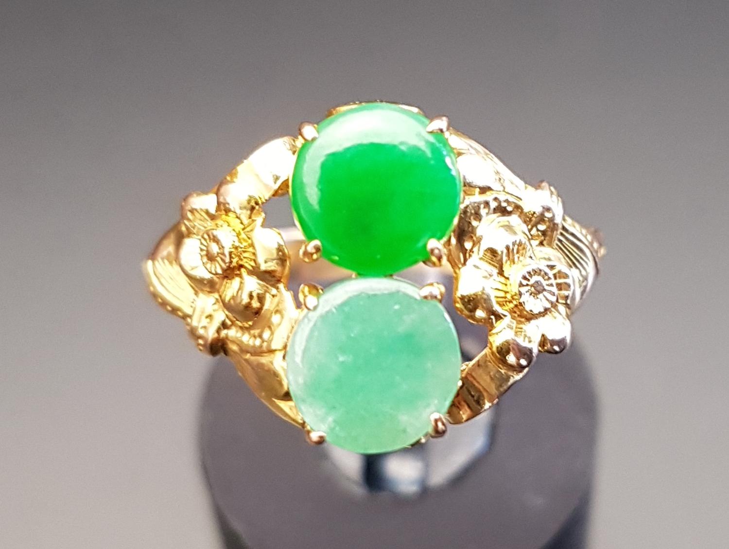 JADE AND JADE COLOURED HARDSTONE RING the darker green jade and lighter hardstone within floral