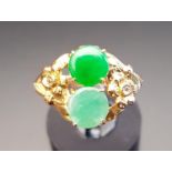JADE AND JADE COLOURED HARDSTONE RING the darker green jade and lighter hardstone within floral