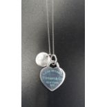 TIFFANY AND CO. SILVER HEART PENDANT ON CHAIN with blue enamel 'Return to Tiffany' lettering; with