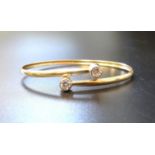 CZ SET NINE CARAT GOLD BANGLE the twist design bangle with CZ finials, approximately 3 grams