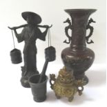 CHINESE BRONZED VASE of shaped form with a flared rim and dragon shaped handles, relief decorated