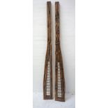 ABSTRACT SCULPTURE formed of two irregular shaped stained pine sections with wavy metal