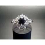 SAPPHIRE AND DIAMOND 'EVIL EYE' CLUSTER RING the central round cut sapphire approximately 0.8cts