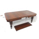 VICTORIAN OAK EXTENDING DINING TABLE with canted corners, windout mechanism and two extra leaves,