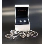 EIGHT PANDORA SILVER RINGS comprising Entwining Silver rings, April Birthstone ring, Hearts Tiara