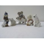 SELECTION OF FIVE LLADRO WINTER FIGURINES depicting a boy and polar bear, 14.5cm high; two