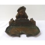 EARLY 20TH CENTURY SPELTER DESK STAND depicting a young boy reading a book flanked by a pair of