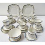 ROYAL ALBERT ORIENT PATTERN TEA SET comprising cups and saucers, side and sandwich plates, milk