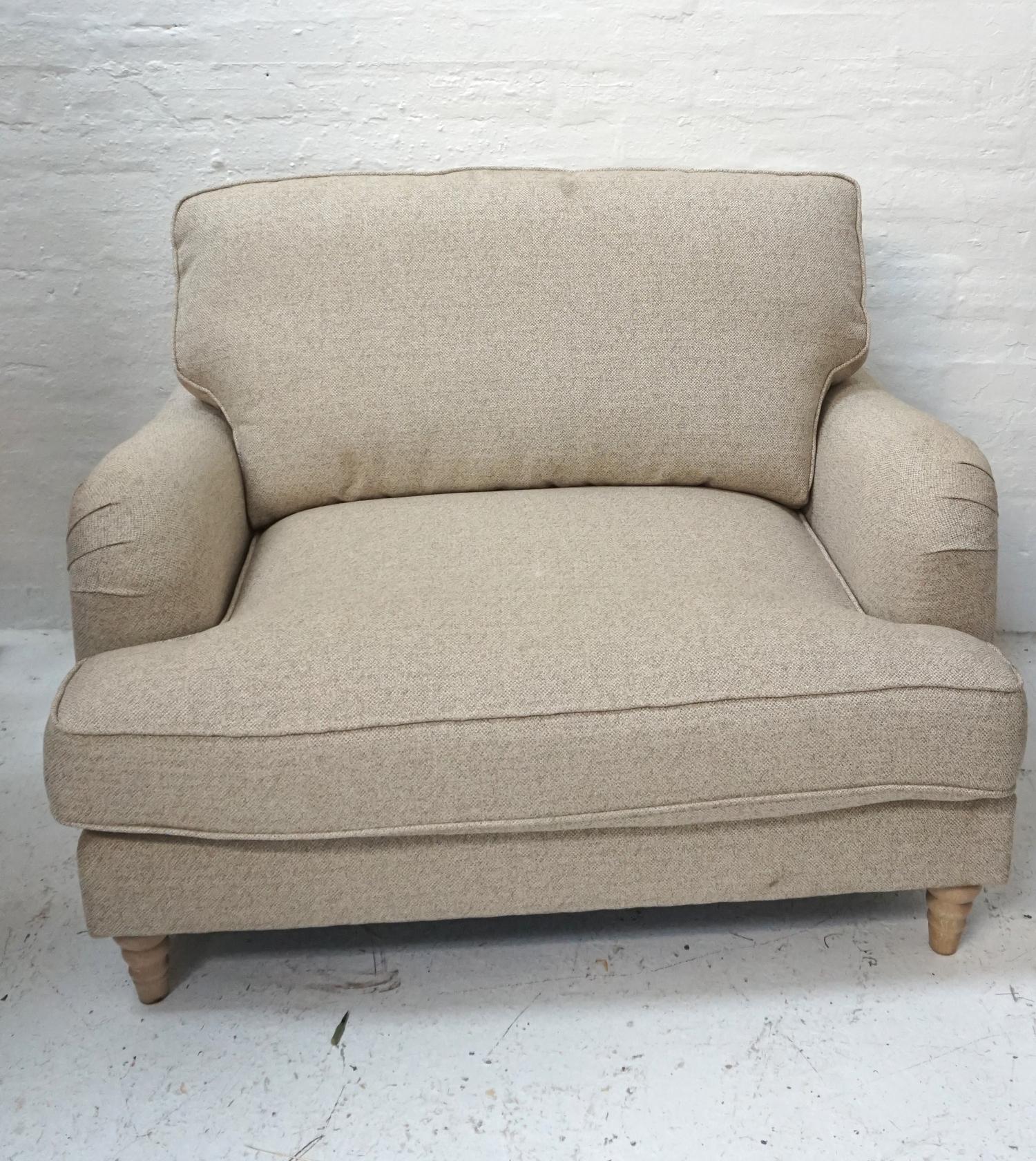 OVERSIZED MODERN ARMCHAIR with a shaped back with loose back and seat cushion, covered in a speckled