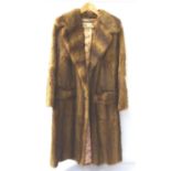 LADYS VINTAGE MUSQUASH FULL LENGTH COAT with pockets and button fastening, bearing a trade label for