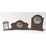 MAHOGANY CASED MANTLE CLOCK with an arched case with bead decoration around the circular silvered