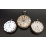 THREE SILVER POCKET WATCHES comprising an Edwardian example with silvered dial and gilt Roman