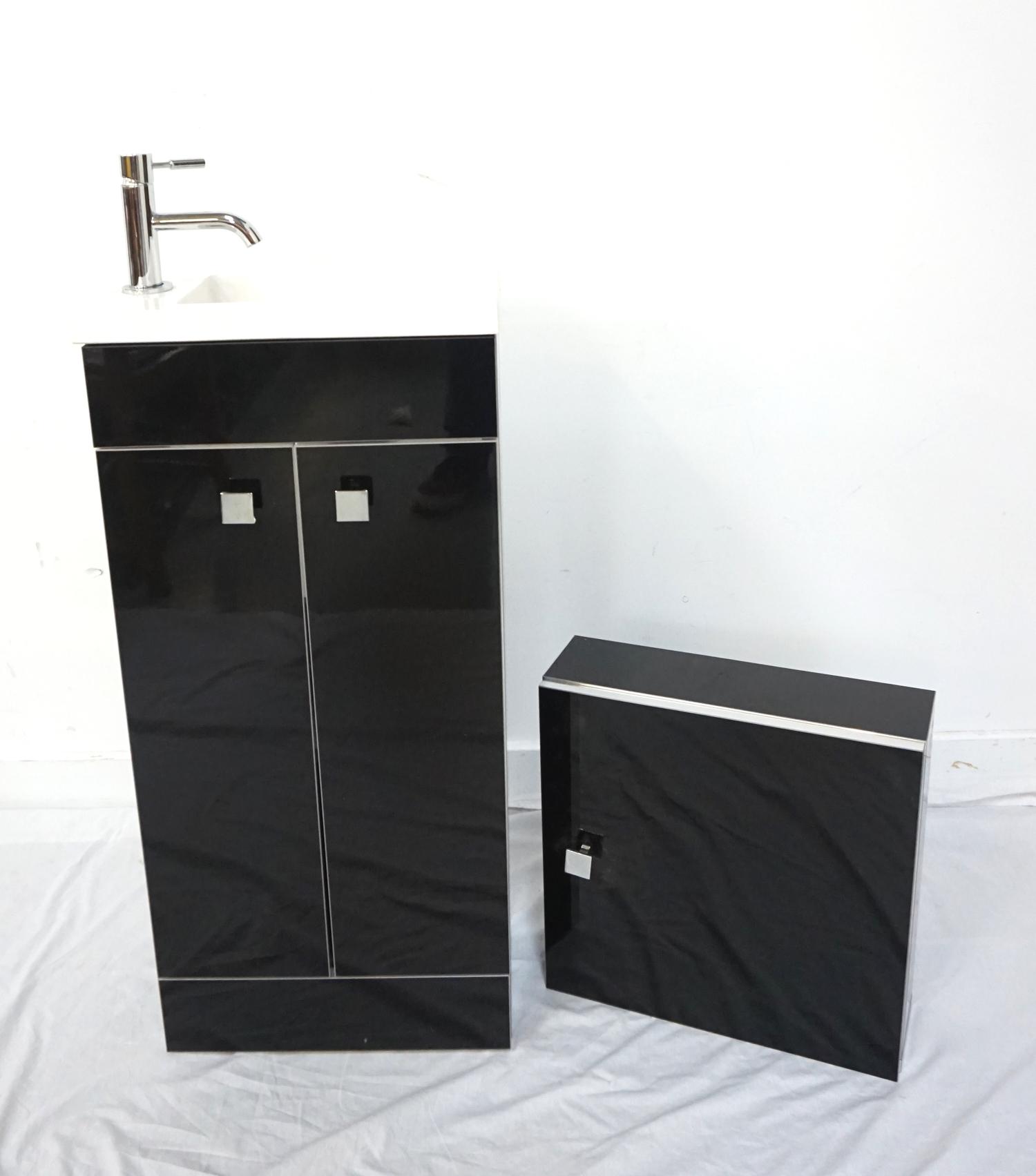 NEW AND UNUSED PORCELAIN SINK and unit, with a mixed tap, mounted in a narrow black gloss base