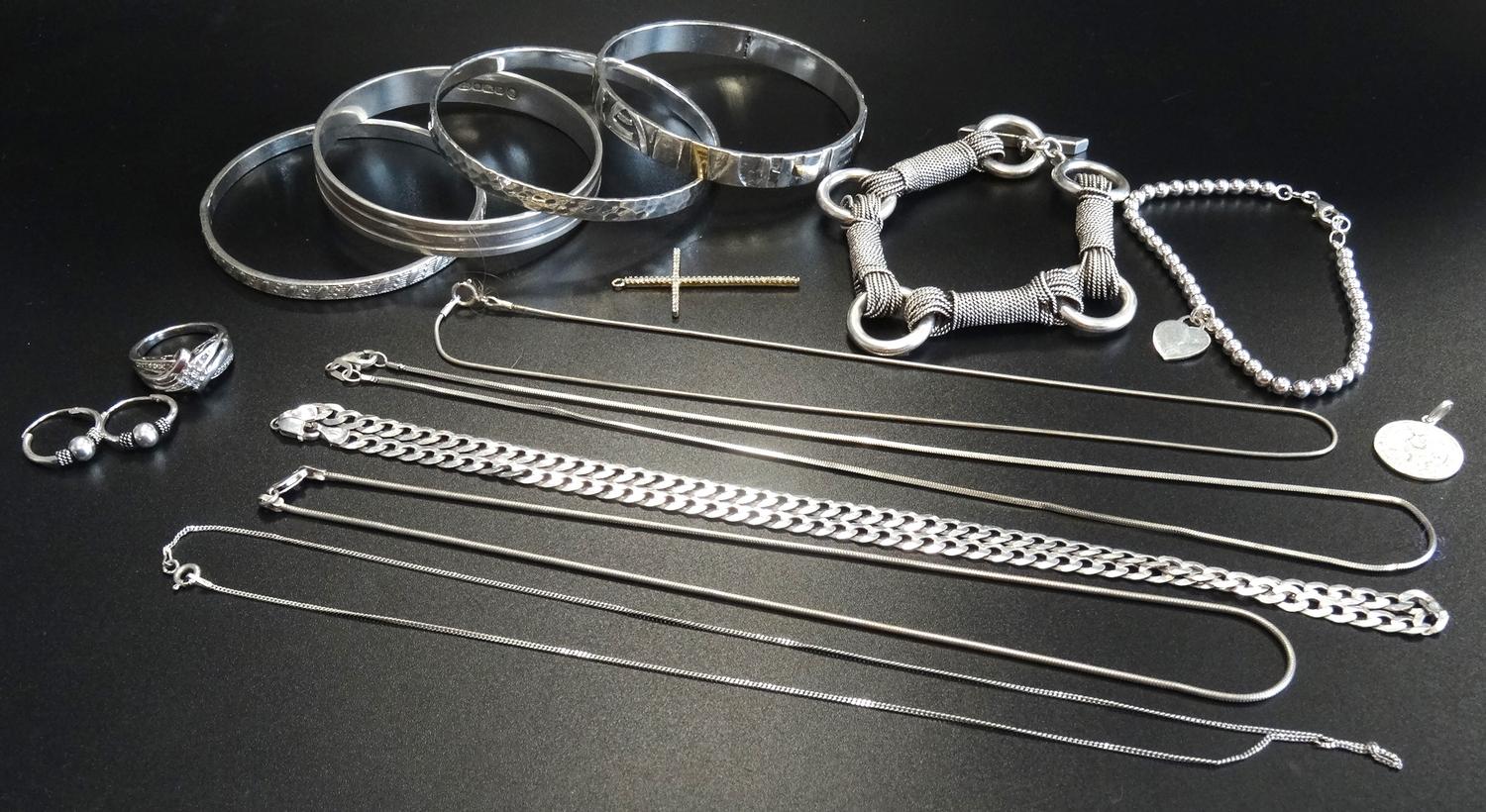 SELECTION OF SILVER JEWELLERY including four bangles, a Tiffany style bead bracelet, a horse bit