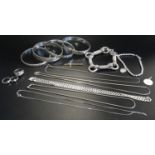 SELECTION OF SILVER JEWELLERY including four bangles, a Tiffany style bead bracelet, a horse bit