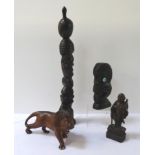 CARVED HARDWOOD AFRICAN LION roaring, 26cm long; a Thai carving of a wise man holding a staff,