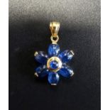 UNUSUAL CABOCHON SAPPHIRE FLOWER DESIGN PENDANT the central bezel set circular sapphire surrounded