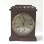 EARLY 20TH CENTURY BRITISH MANTLE CLOCK in a shaped mahogany case with a circular silvered dial with