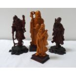 FOUR CHINESE CARVED WOODEN FIGURES depicting a wiseman, scholar, farmer and a traveller, all on
