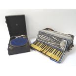 SETTIMIO SOPRANI ACCORDION with a blue cased body, shoulder strap, cased, together with a cased