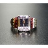 PALE AMETHYST AND PINK GEM SET DRESS RING the central emerald cut amethyst flanked by a vertical row