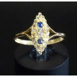 VICTORIAN SAPPHIRE AND DIAMOND CLUSTER DRESS RING in navette shaped setting, the central diamond