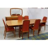 NATHAN TEAK DINING ROOM SUITE comprising an extending shaped dining table standing on shaped