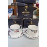 SELECTION OF BOXED ROYAL DOULTON comprising three sets of two cups and saucers in the Autumn's Glory