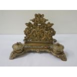VICTORIAN STYLE BRASS DESK STAND with scrolled and figural pierced decoration, letter rack, pen