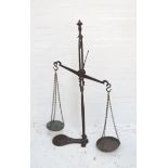 SET OF VICTORIAN CAST IRON SHOP SCALES the central balance arm with two chain link weighing bowls,