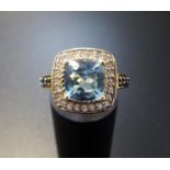 AQUAMARINE, DIAMOND AND SAPPHIRE DRESS RING the central cushion cut aquamarine in diamond surround