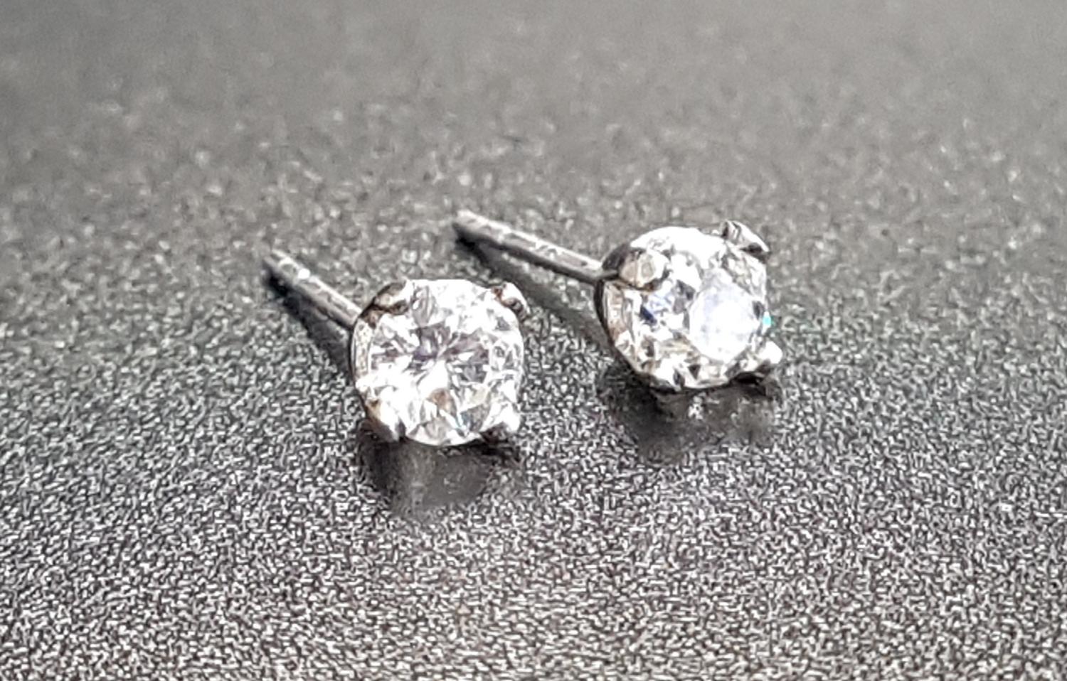 PAIR OF DIAMOND STUD EARRINGS the round brilliant cut diamonds approximately 0.25cts each, in nine