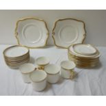 TUSCAN PORCELAIN TEA SERVICE the white ground with gilt highlights, comprising tea cups and saucers,