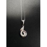 DIAMOND SET SPIRAL DESIGN PENDANT in nine carat white gold and on nine carat white gold chain