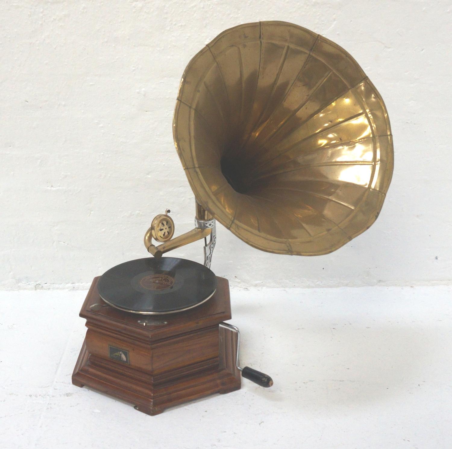 REPRODUCTION HMV GRAMOPHONE in hexagonal oak case, with wind up handle and brass trumpet