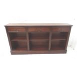 REGENCY STYLE MAHOGANY AND CROSSBANDED SIDE CABINET with a moulded top above three frieze drawers