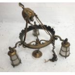 BRASS CEILING LIGHT suspended by three tubular arms to a circular ring with castletations and