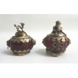 TWO CHINESE WHITE METAL PASTEL BURNERS with circular hardstone bodies with lion mask side handles
