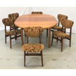 MCINTOSH CIRCULAR TEAK EXTENDING DINING TABLE with a pull apart top revealing a fold out leaf,