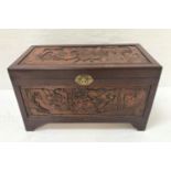 CHINESE CAMPHOR WOOD CHEST with profuse all over carving, standing on bracket feet, 105cm wide