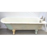 EDWARDIAN CAST IRON ROLL TOP BATH white enamelled, standing on scroll feet, with brass chrome taps